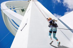 A person abseiling down the Spinnaker Tower in Portsmouth